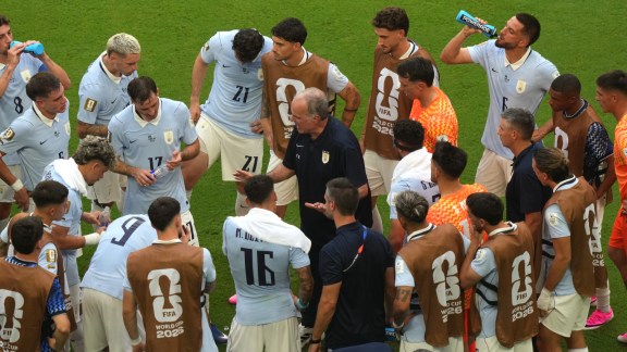 Uruguay head coach Marcelo Bielsa talks to players during the World Cup Group H match against Saudi Arabia. (AP)