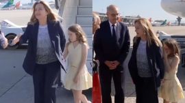 During formal interactions and greetings with officials, she was occasionally seen standing behind Meloni