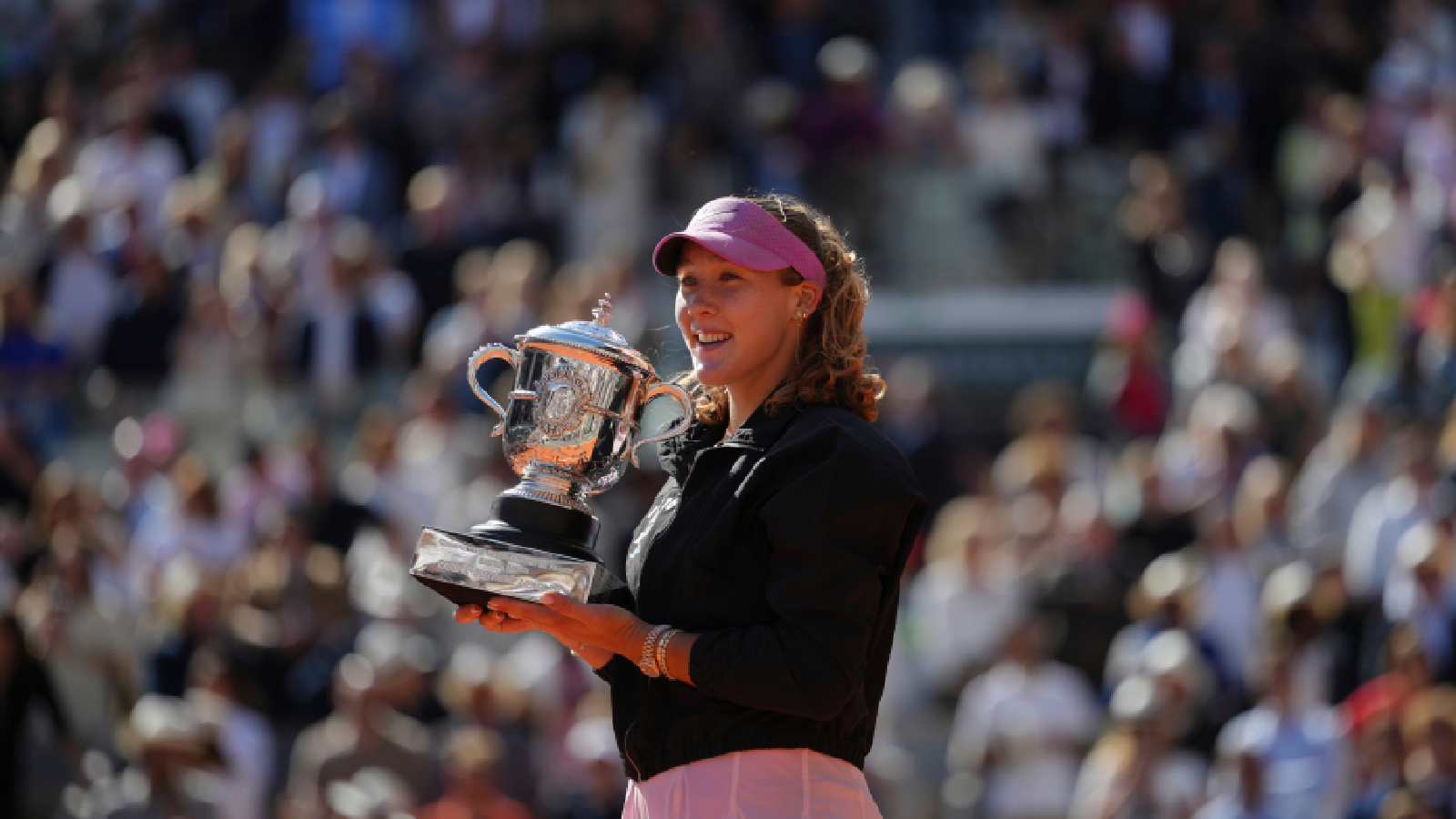 Russia's Mirra Andreeva poses with the trophy after winning the final women's tennis match against Poland's Maja Chwalinska at the French Open in Paris, Saturday, June 6, 2026. (AP Photo/Aurelien Morissard)