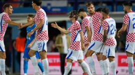 Croatia's Luka Modric, centre, celebrates with teammates after scoring his side's opening goal during the international friendly soccer match between Croatia and Slovenia in Varazdin, Croatia, Sunday, June 7, 2026. (AP Photo/Darko Bandic)