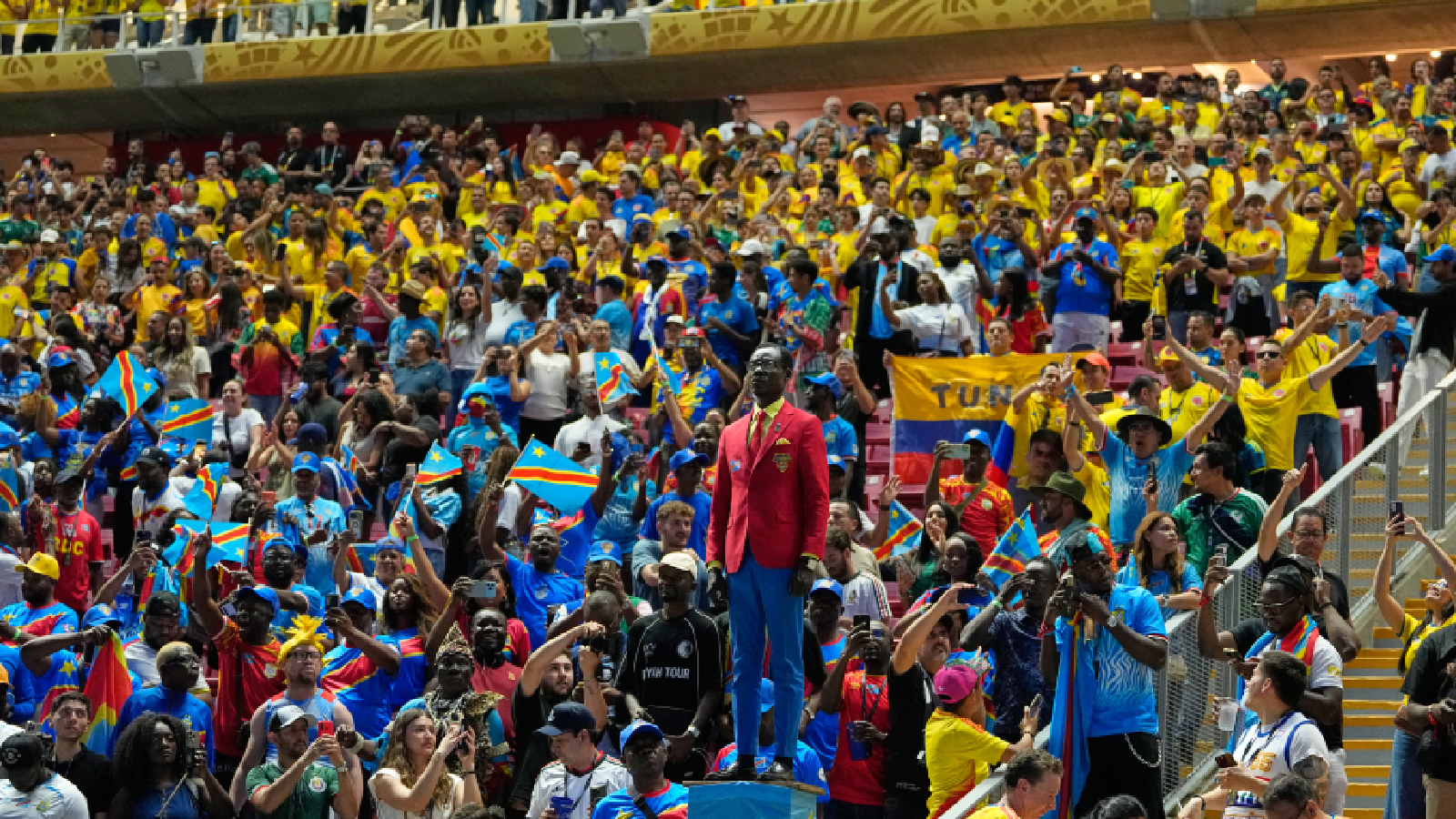 Congo supporter Michel Nkuka Mboladinga, poses as a statue of the country's assassinated independence hero Patrice Lumumba ahead of the World Cup Group K soccer match between Colombia and Congo in Zapopan, near Guadalajara, Mexico, Tuesday, June 23, 2026. (AP Photo/Natacha Pisarenko)