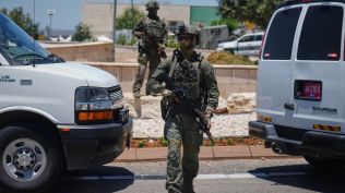 Israeli security forces are deployed at the scene of a shooting attack carried out by a Palestinian citizen of Israel near Tzur Yitzhak in central Israel, Sunday, June 7, 2026. (AP Photo)