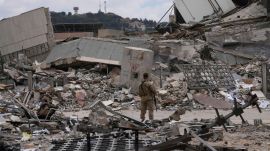 A Lebanese soldier stands in front of a destroyed branch of the Lebanese Central Bank in the town of Nabatiyeh, southern Lebanon, Monday, June 22, 2026. (AP Photo)