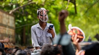 A participant wears a cockroach mask as supporters of the Cockroach Janta Party gather for a protest demonstration in New Delhi, India, Saturday, June 6, 2026. (AP Photo/Manish Swarup)