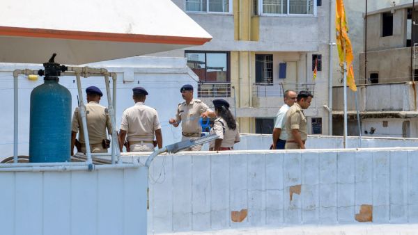Police personnel inspect the site after RSS alleged that petrol bombs were hurled at its office, in Ranchi, Wednesday, June 17, 2026. (PTI Photo) 