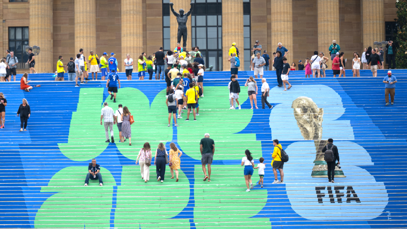 Brazilian and other soccer fans climb the steps leading to the Rocky statue, marked with a FIFA World Cup logo, in Philadelphia, on Thursday, June 18, 2026, ahead of Friday's FIFA World Cup Group C match between Brazil and Haiti. (Jose F. Moreno/The Philadelphia Inquirer via AP)/The Philadelphia Inquirer via AP)