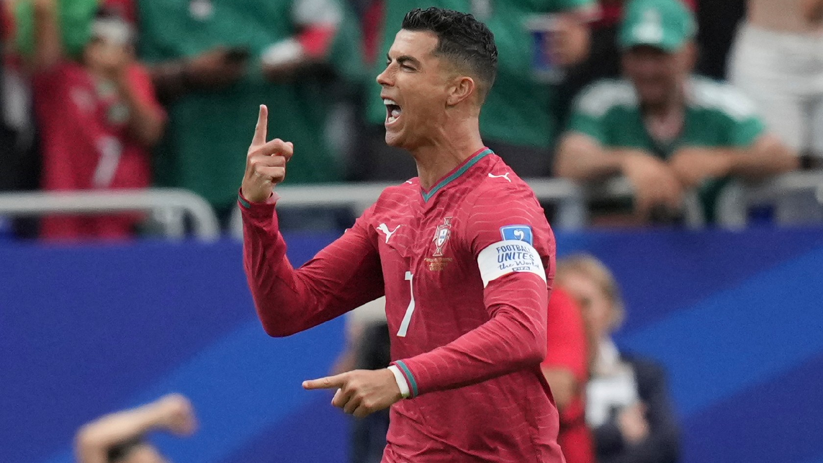 Portugal's Cristiano Ronaldo (7) celebrates after scoring the opening goal of his team during the World Cup Group K soccer match between Portugal and Uzbekistan in Houston, Tuesday, June 23, 2026. (AP Photo/Eric Gay)