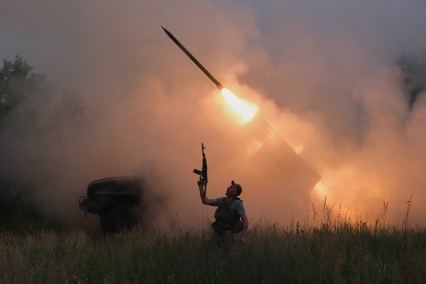 A Ukrainian soldier reacts as an MRLS BM-21 "Grad" fires at the Russian positions near Kostiantynivka, Donetsk region. (AP)