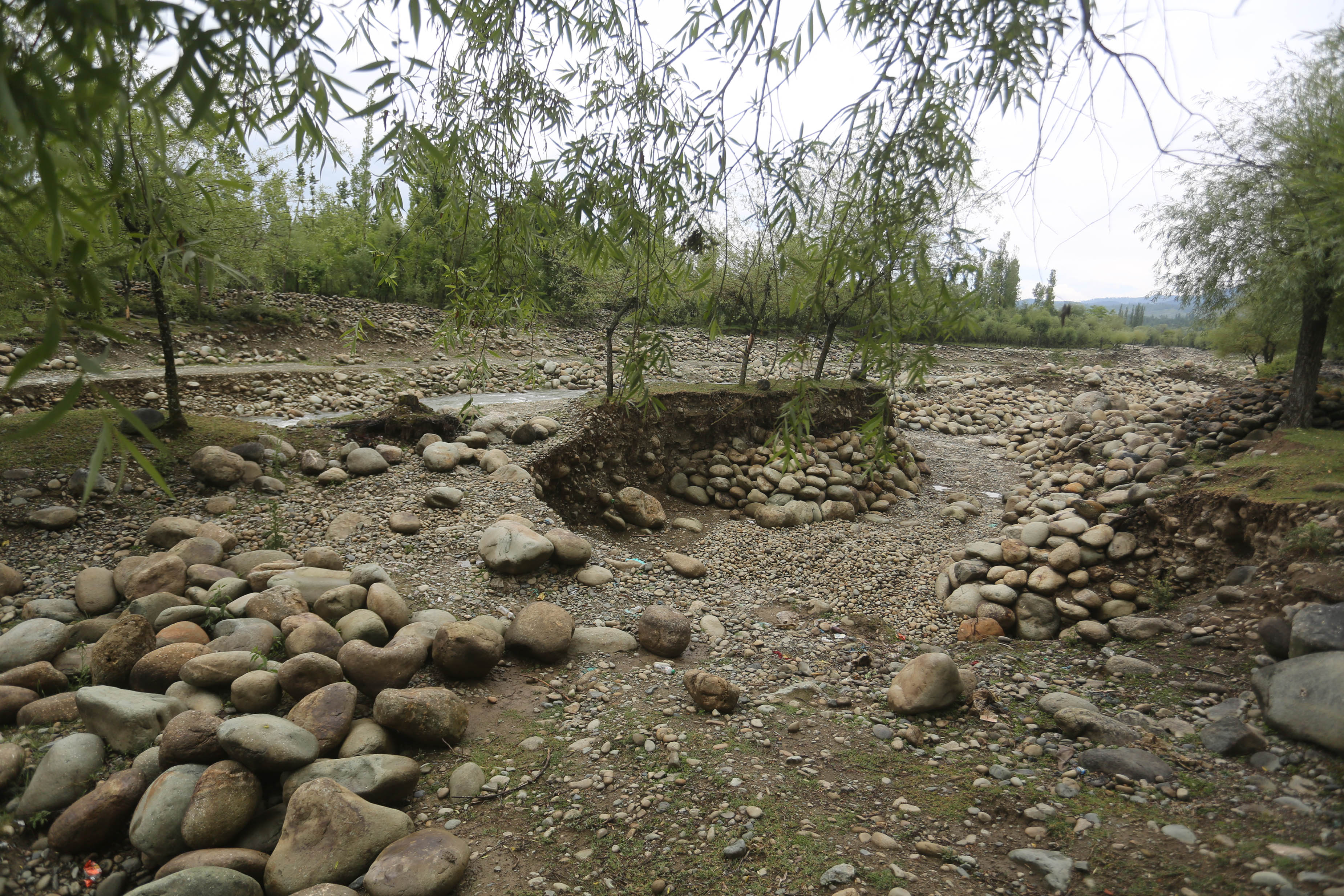 In Kashmir village once known for its springs, mining leaves river scarred, fields barren