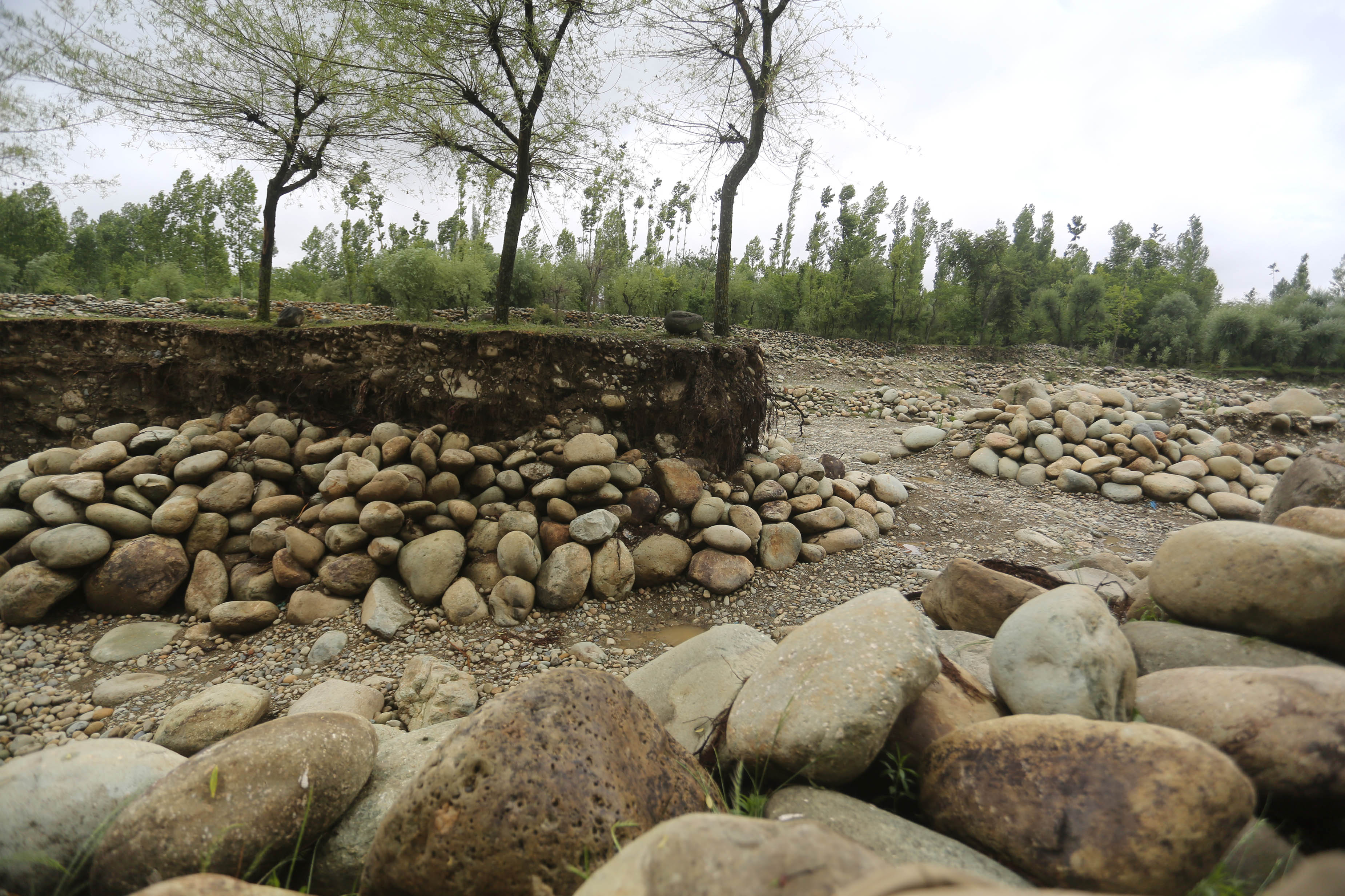 In Kashmir village once known for its springs, mining leaves river scarred, fields barren