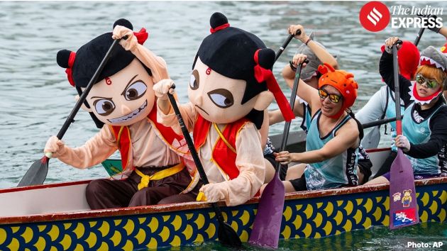 Participants in Hong Kong’s dragon boat races on Friday wore costumes including a cartoon
