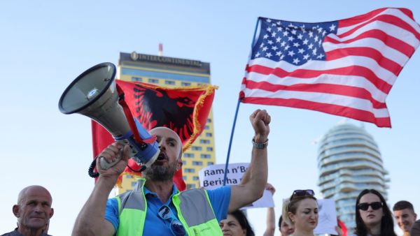 Protesters take part in a rally in Tirana, Albania, Tuesday, June 9, 2026, against the construction of a massive coastal development project linked to Jared Kushner and Ivanka Trump at Narta lagoon area, western Albania. (AP Photo/Hameraldi Agolli)
