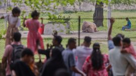 Visitors look at a rare albino buffalo fondly named after Donald Trump for its distinctive blond tuft kept in an enclosure at the national zoo, in Dhaka, Bangladesh, Friday, May 29, 2026. (AP Photo)