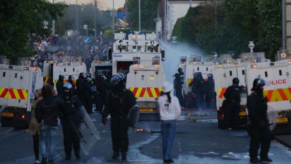 Police use water-cannons to disperse protesters near Newtownabbey, in Belfast, Northern Ireland, Wednesday, June 10, 2026, following a stabbing incident on Monday night. (AP Photo)
