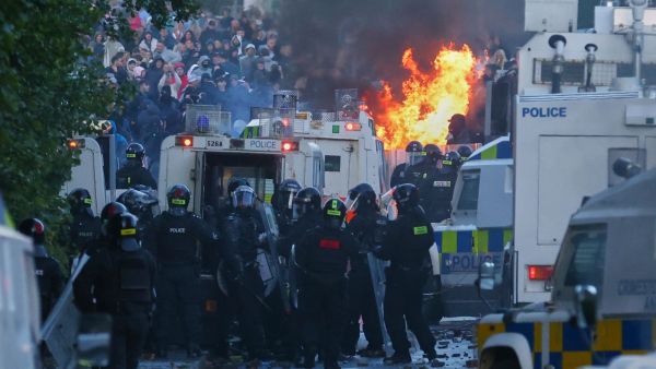 Police attempt to clear protesters near Newtownabbey, in Belfast, Northern Ireland, Wednesday, June 10, 2026, following a stabbing incident on Monday night. (AP Photo)