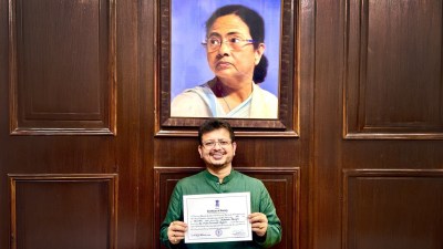 Ousted TMC leader Ritabrata Banerjee below the portrait of TMC chief and former West Bengal CM Mamata Banerjee in an old photo; Ritabrata leaves from Vidhan Sabha, in Kolkata on Wednesday. (Express Photo, ANI)