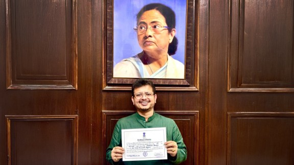 Ousted TMC leader Ritabrata Banerjee below the portrait of TMC chief and former West Bengal CM Mamata Banerjee in an old photo; Ritabrata leaves from Vidhan Sabha, in Kolkata on Wednesday. (Express Photo, ANI)