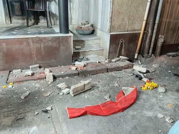 Debris crashed onto a crowded thoroughfare after a dilapidated structure gave way, prompting emergency checks on nearby old buildings to prevent future accidents. (Credit: Special Arrangement)