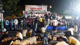 Protesters rest on the floor during a protest by Cockroach Janata Party seeking Union Education Minister Dharmendra Pradhan’s resignation over the NEET (UG) 2026 paper leak, in New Delhi. (ANI Photo)