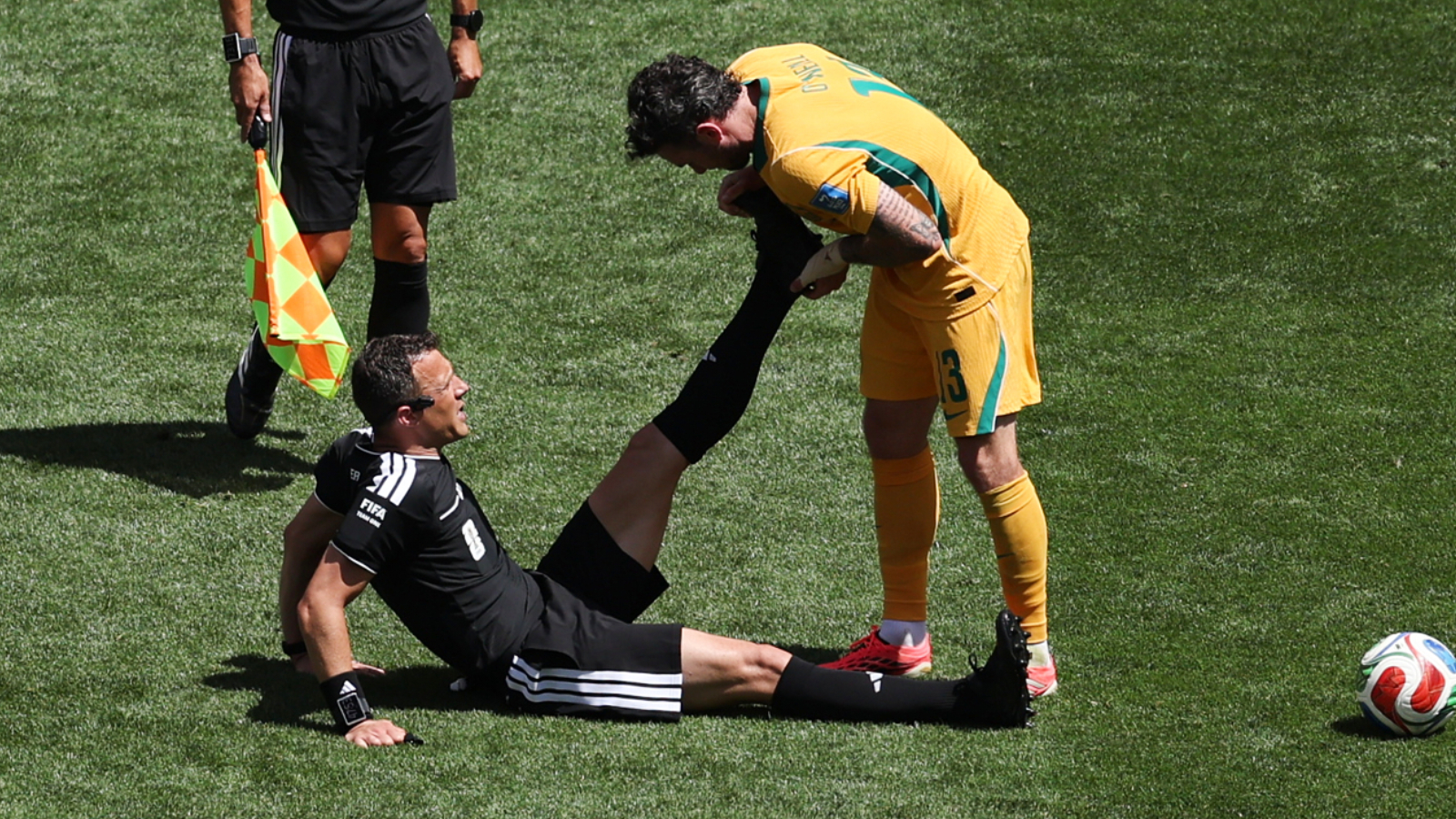 In a bizarre finish to the USA-Australia World Cup match, referee Felix Zwayer collapsed with cramps in stoppage time. (AP Photo)