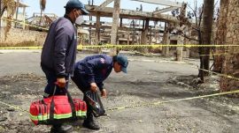 Personnel from the National 911 Emergency System conduct an investigation following the fire that destroyed the Viva Wyndham Dominicus Beach hotel in Bayahibe, Dominican Republic, Saturday, June 20, 2026. (AP Photo/Martin Adames)
