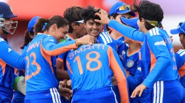 India's Shree Charani celebrates bowling and catching out South Africa's Laura Wolvaardt during the ICC Women's T20 World Cup match between India and South Africa, at Emirates Old Trafford, Manchester, England, Sunday June 21, 2026. (Nigel French/PA via AP)
