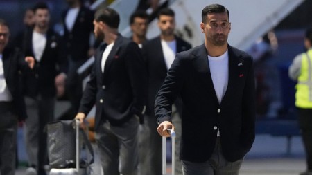 Iran's Ehsan Hajisafi, right, arrives with his teammates for the World Cup soccer tournament in Tijuana, Mexico, Sunday, June 7, 2026. (AP Photo/Gregory Bull)