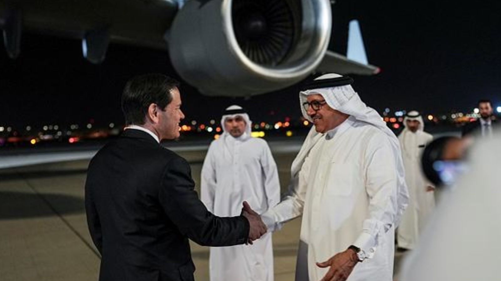 Bahrain's Foreign Minister Abdullatif bin Rashid Al Zayani, right, greets US Secretary of State Marco Rubio upon arrival at Bahrain International Airport during his visit to the Middle East. (AP Photo)