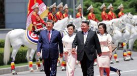 Chinese President Xi Jinping, and his wife Peng Liyuan, accompanied by North Korean leader Kim Jong Un, second right, and his wife his wife Ri Sol Ju attend a welcome ceremony in Pyongyang (PTI)