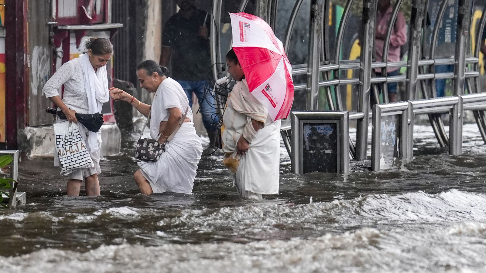 Tracks cave in, trains stall, buses break down as monsoon rain disrupts Mumbai