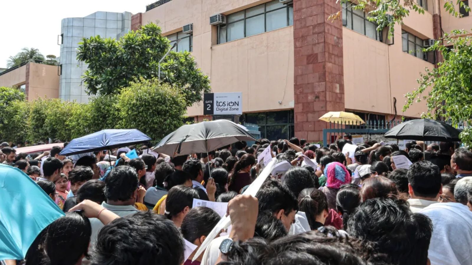 Aspirants gather at entry check points at an examination centre. Follow The Indian Express for breaking news and live news updates from India and around the world.