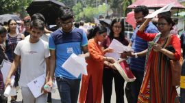 NEET UG 2026 aspirants arrive at an examination centre for the retest amid heightened security, June 21, 2026. Follow The Indian Express for breaking news and live news updates from India and around the world.