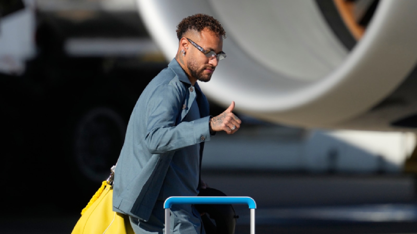 Neymar gives a thumbs up as he disembarks at Newark Liberty International Airport in Newark, N.J., Tuesday, June 2, 2026, as the Brazil arrive ahead of the World Cup. (AP Photo)