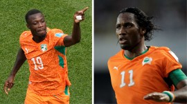 Didier Drogba (R) spent twenty years making possible the Ivory Coast that Nicolas Pepe (L) just took into the World Cup knockout rounds for the first time. (AP Photo)