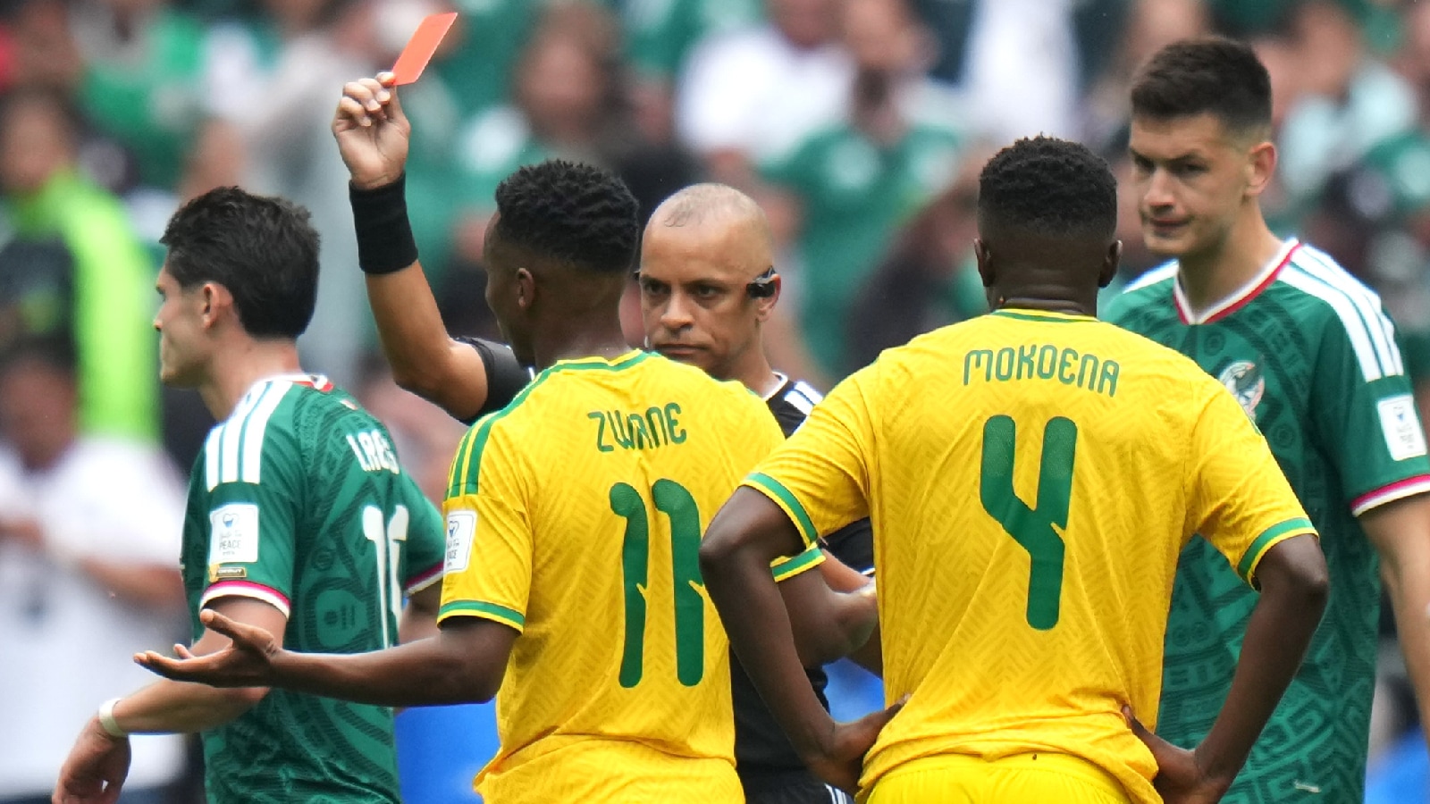 South Africa's Themba Zwane is shown a red card from referee Wilton Sampaio in the second half during the World Cup Group A soccer match between Mexico and South Africa in Mexico City. (AP Photo)