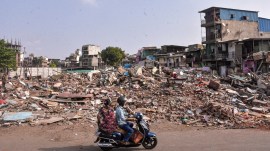 Gujarat HC Surat demolition, Surat slum demolition, Gujarat High Court demolition case, due process demolition, Nasirnagar demolition, Surat Municipal Corporation, Torrent Power disconnection, illegal demolition case, Justice Nikhil Kariel, bulldozer action Gujarat, Indian express news