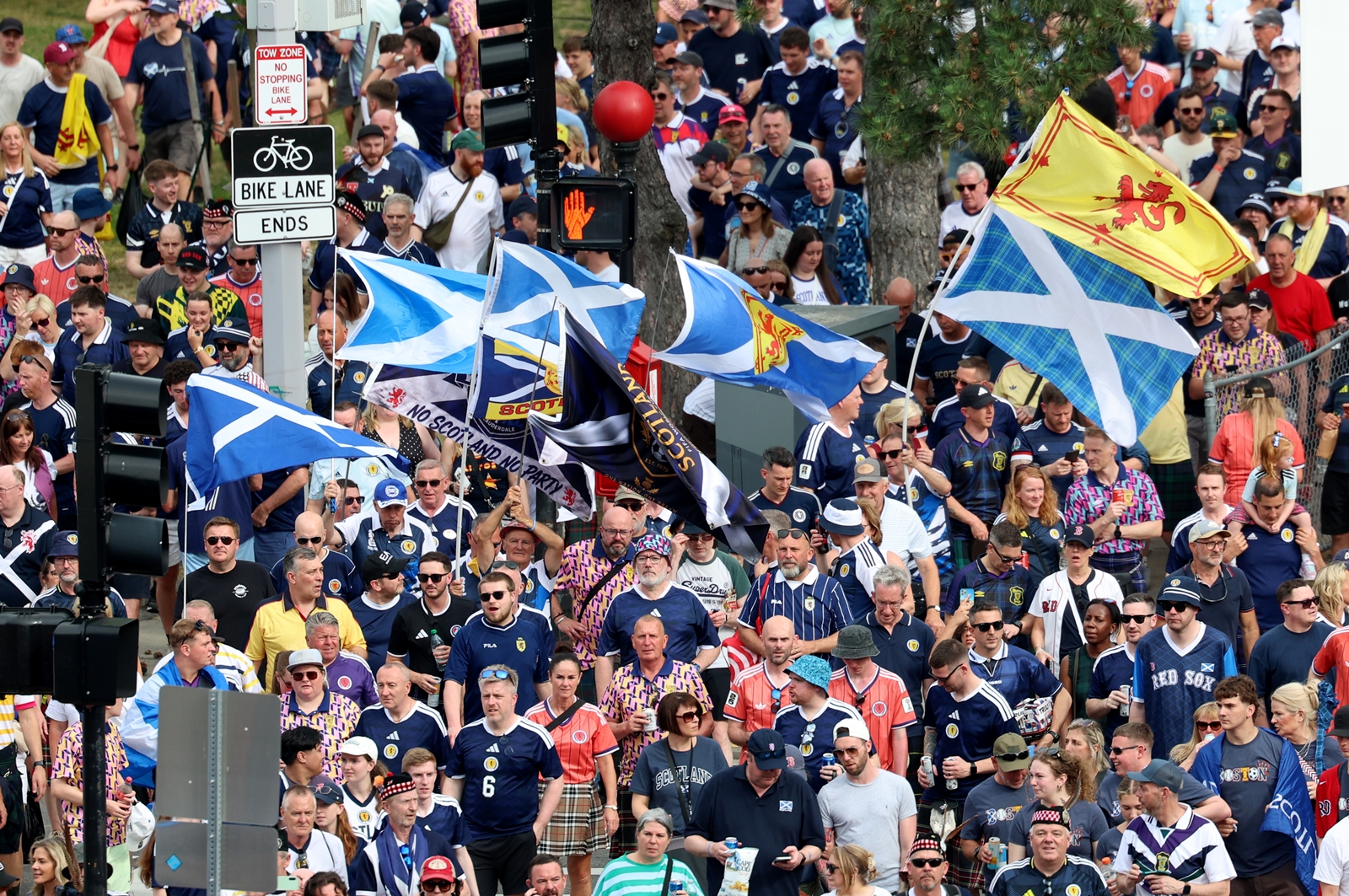 Scotland football fans take part in the Tartan Army March, making their way to Fenway Park ahead of a baseball game between the Boston Red Sox and the Texas Rangers. (AP Photo/Mark Stockwell)