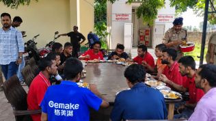 The rescued bonded labourers in UP’s Muzaffarnagar, served lunch by the police. (Express Photo)