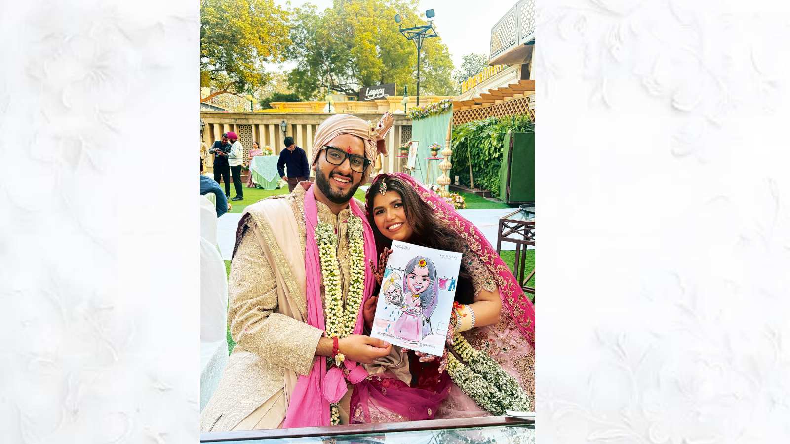 A couple with their caricature drawn by Suraj Shah