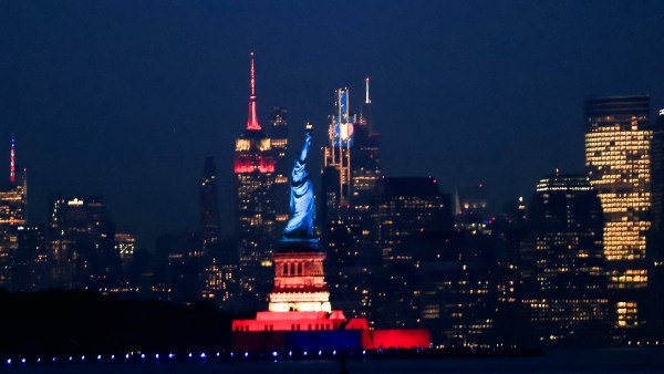 The Statue of Liberty is lit up ahead of the commemoration of the 250th anniversary of US independence, as seen from Bayonne, New Jersey, July 1, 2026. (REUTERS)