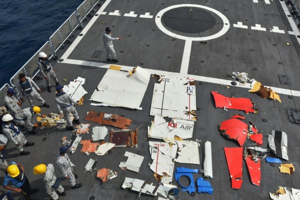Pakistan Navy personnel examine the wreckage of a cargo plane of the private carrier K2 Airways on a naval ship after recovering them from deep sea near Omara. (AP)