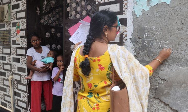 At each house, health workers urge families to tell them if they have a child under 5 years so they can be vaccinated. (Express Photo by Amit Mehra)