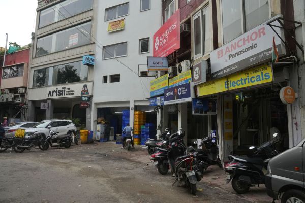 Juxtaposition of cafes and hardware stores. (Express Photo by Abhinav Saha)