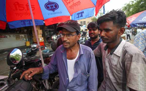 Sanjay Kumar and Abhishek, mechanics at Karol Bagh. (Express Photo by Praveen Khanna)
