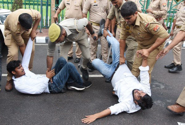Samajwadi Party Youth wing workers hold a protest against state government on Mohammad Ali Jauhar University, demolition order, in front of state assembly in Lucknow on Monday. (Express Photo by Vishal Srivastav)