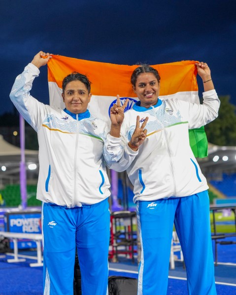 India's Sharmila Dhankar, left, and Shilpa K Shyla celebrate after winning gold and bronze medals respectively in the women's shot put F57 at the 23rd Commonwealth Games in Glasgow. (PTI)