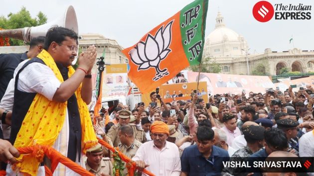 Some party workers were seen standing on a bulldozer from where they showered petals on him