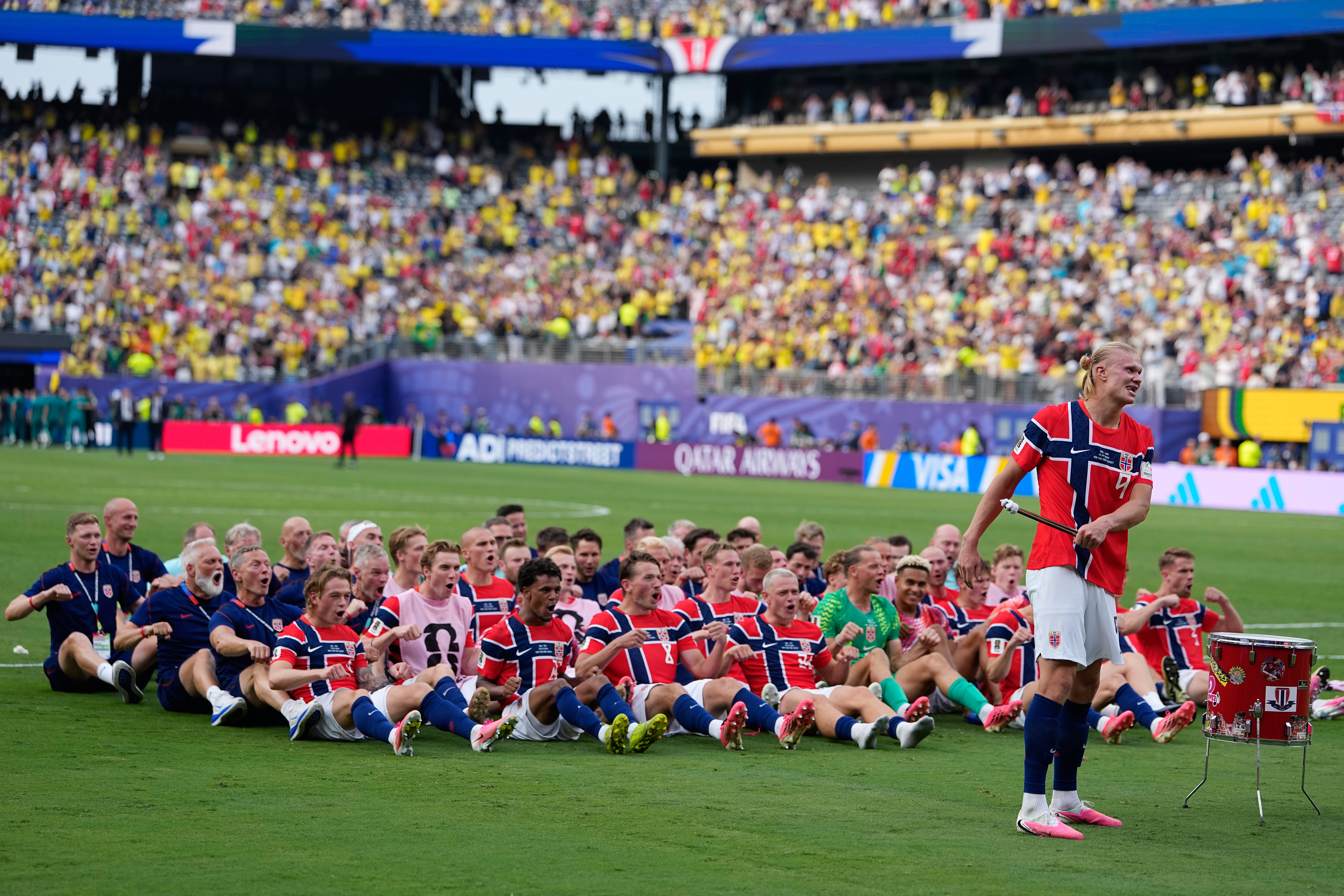 Norway's Erling Haaland (9) leads the team as they participate in a viking boat row after the World Cup round of 16 match against Brazil. (AP Photo/Frank Franklin II)