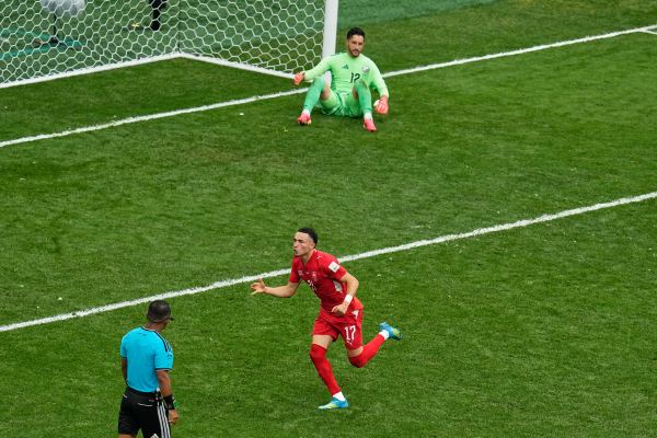 Switzerland's Ruben Vargas (17) reacts after scoring the winning penalty shot. (AP Photo/Gregory Bull)