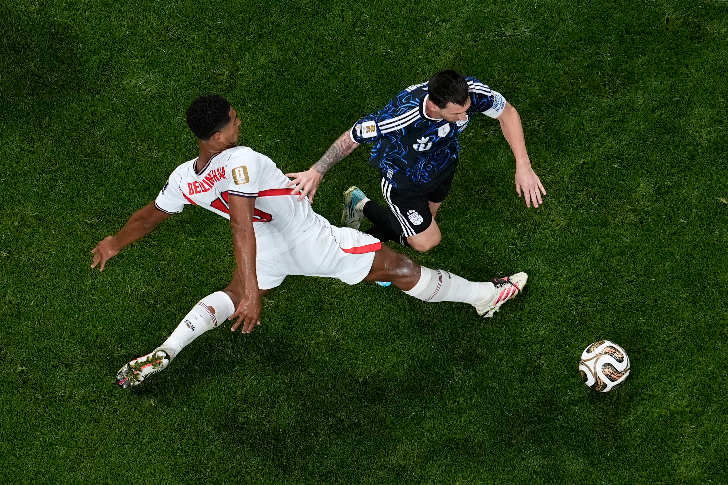 Bellingham, left, and Messi collide during the World Cup semifinal match between England and Argentina in Atlanta. (AP Photo/George Walker IV)